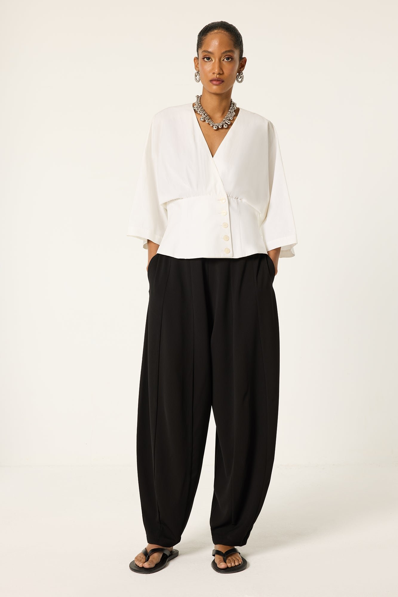PLEATED CREPE TROUSERS