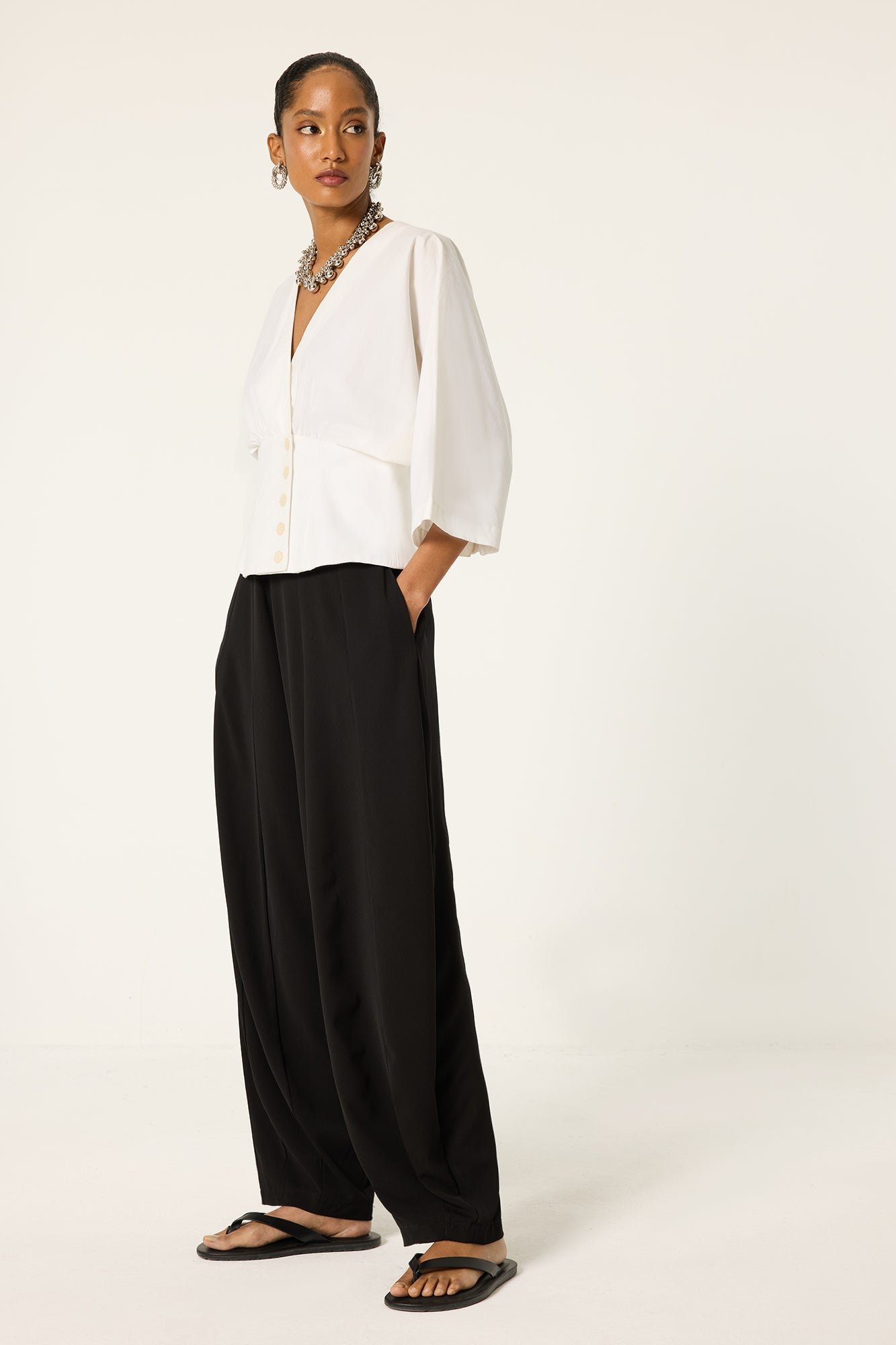PLEATED CREPE TROUSERS